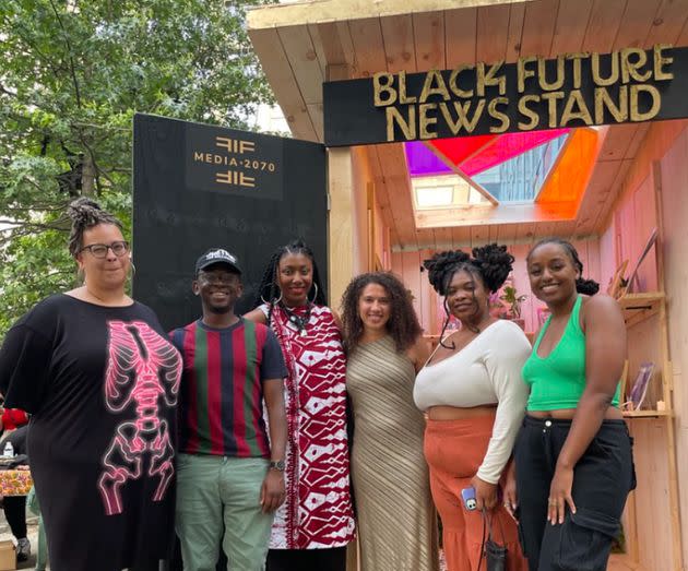 Members of the Media 2070 campaign stand outside of the Black Future News Stand, a landmark installation and collaborative project with the Black Thought Project, in 2023. The newsstand displayed zines and news outlets created by Black journalists and creatives at the Schomburg Center Literary Fest in Harlem.