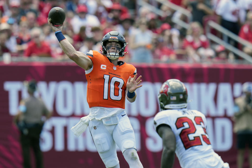 Denver Broncos quarterback Bo Nix (10) throws a pass over Tampa Bay Buccaneers safety Tykee Smith (23) during the first half of an NFL football game, in Tampa, Fla. on Sunday, Sept. 22, 2024. (AP Photo/Chris O'Meara)