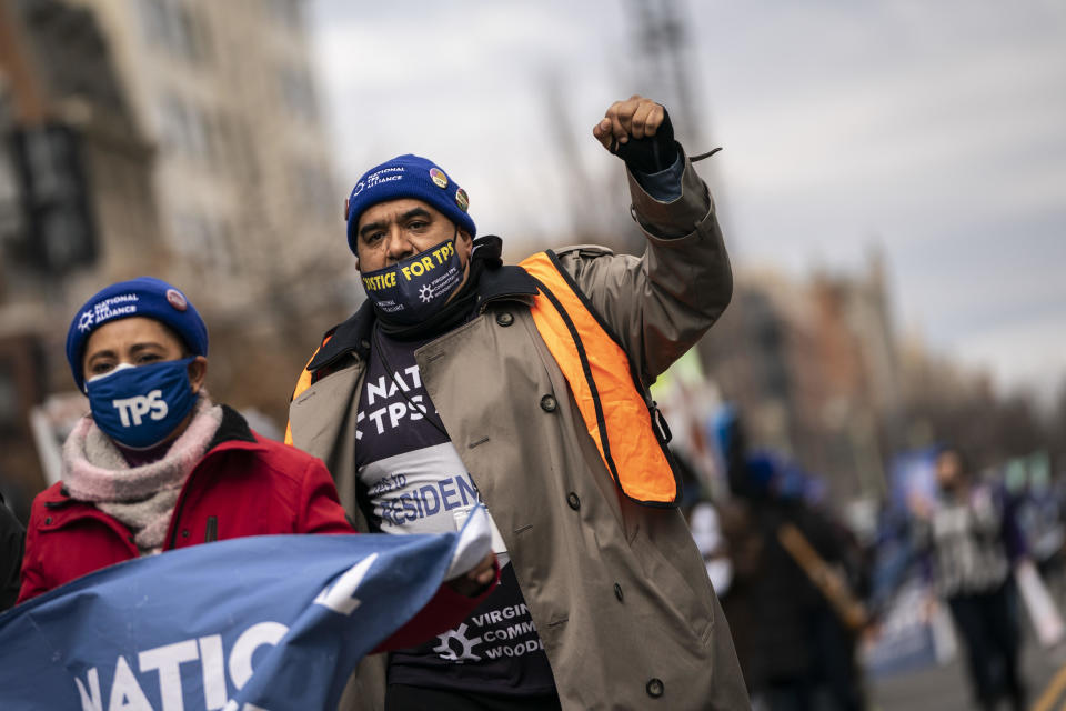 Activists and immigrants with temporary protected status march toward the White House on Feb. 23, 2021, in Washington, D.C., in a call for Congress and the Biden administration to pass immigration reform legislation.  / Credit: Drew Angerer/Getty Images