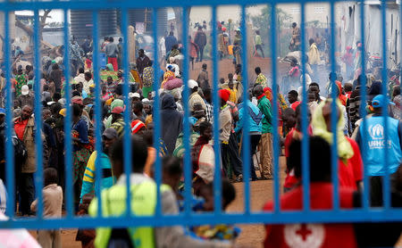 Congolese people who fled from Democratic Republic of Congo by fleeing on a boat across Lake Albert, gather at a United Nations High Commission for Refugees' (UNHCR) Kyangwali refugee settlement camp, Uganda March 19, 2018. REUTERS/James Akena