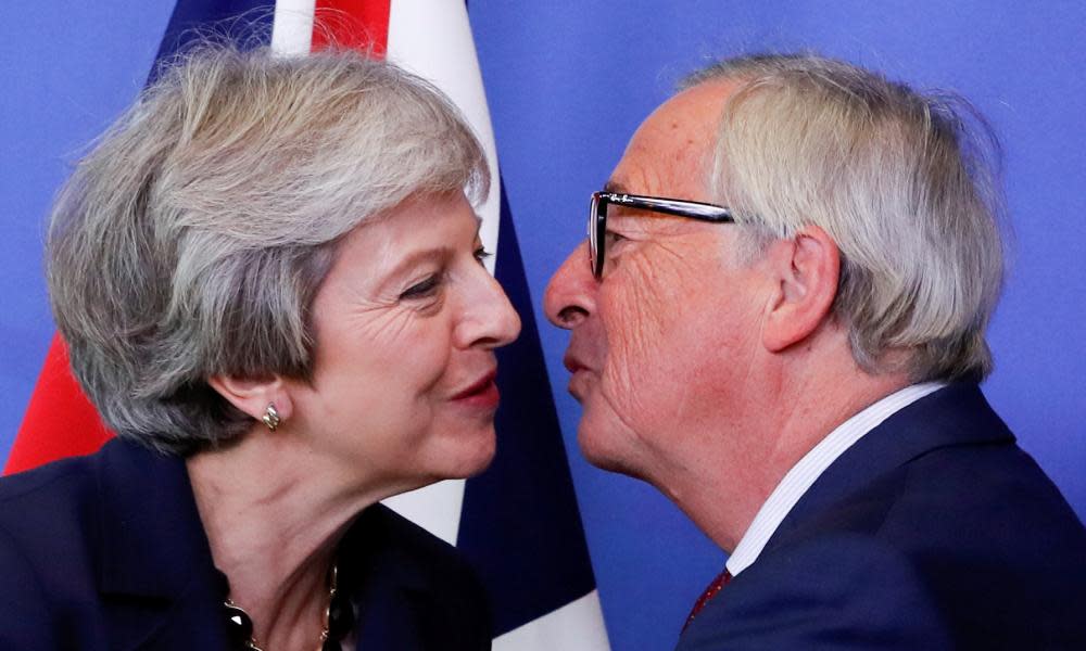 Theresa May is welcomed to Brussels by European commission president Jean-Claude Juncker.