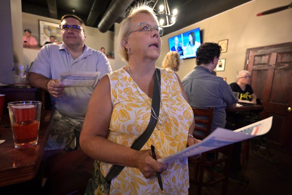 Tammy Garthwaite of Manchester, NH, center, was among the potential voters watch the first Republican presidential debate at Murphy's Taproom in Manchester, N.H. Aug 23, 2023.