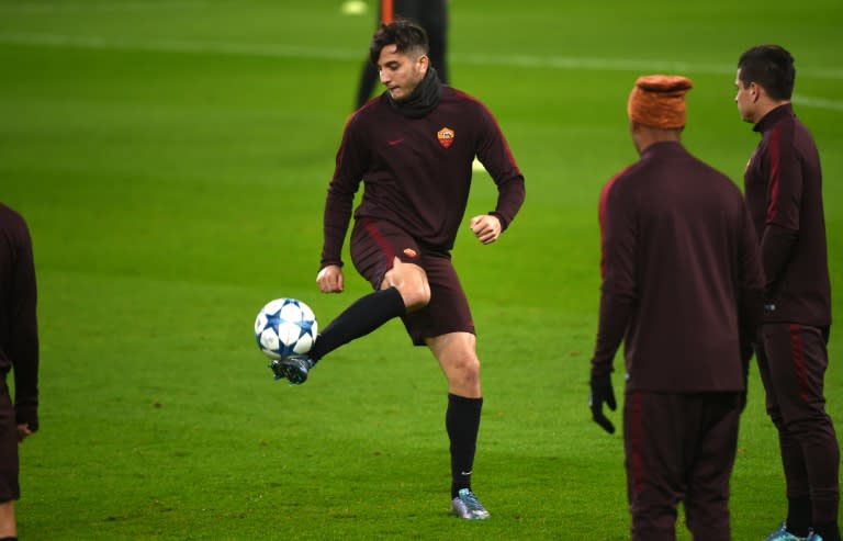 Roma's 4-0 thrashing of Udinese was overshadowed by the sight of highly-rated Greek centre-back Kostas Manolas (C) limping off injured