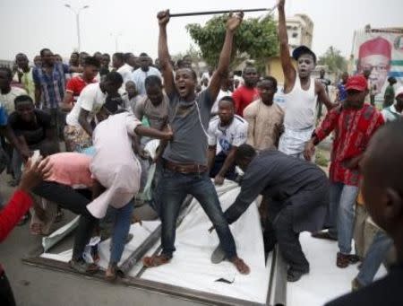 Supporters of the presidential candidate Muhammadu Buhari and his All Progressive Congress (APC) party celebrate in Kano March 31, 2015. Nigeria's opposition APC declared an election victory on Tuesday for former military ruler Buhari and said Africa's most populous nation was witnessing history with its first democratic transfer of power. REUTERS/Goran Tomasevic TPX IMAGES OF THE DAY