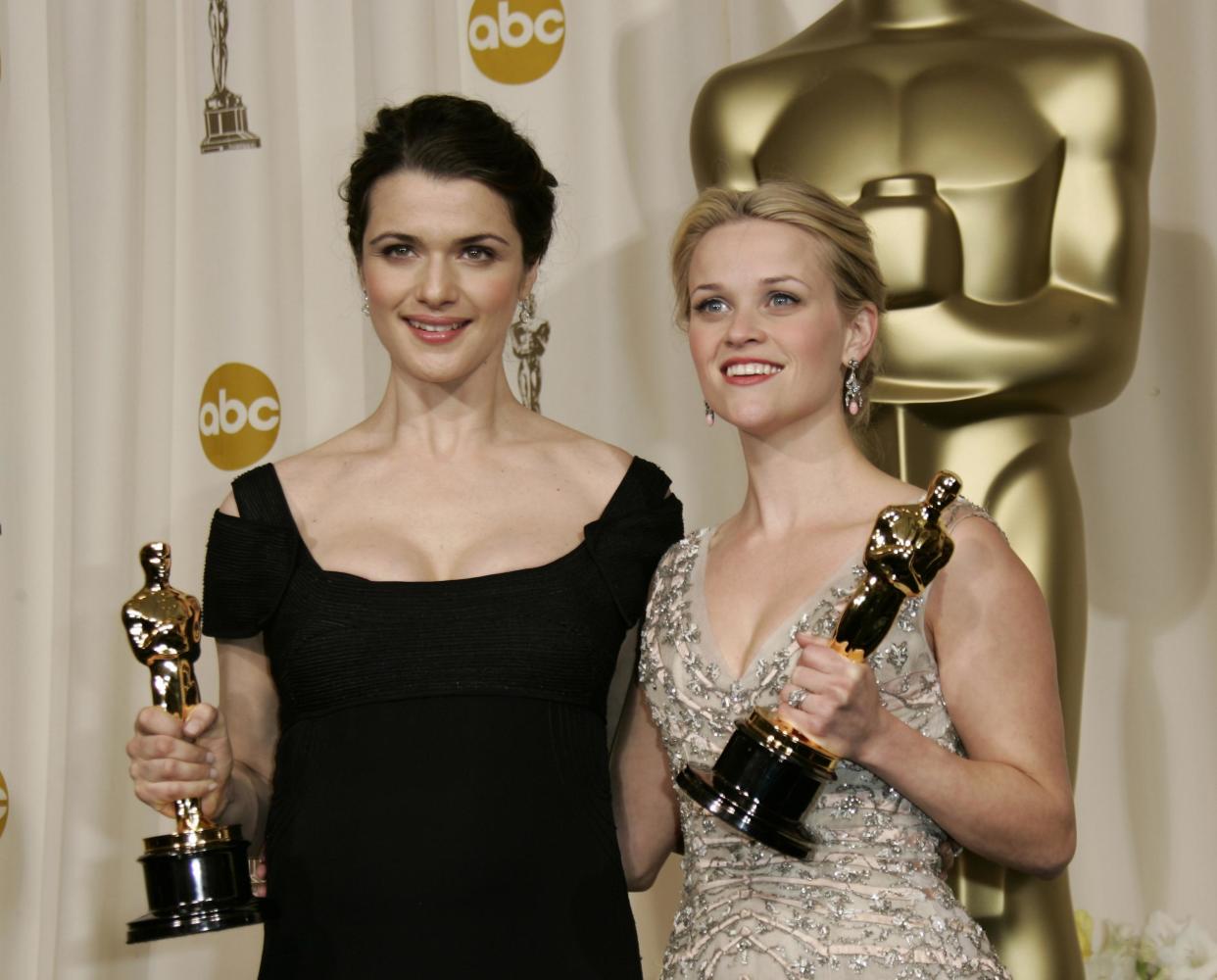 Winner: Reese Witherspoon, right, poses with the Oscar she won for best actress Walk the Line, along Rachel Weisz with her Oscar who won best supporting actress for her work in