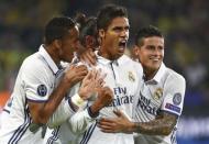 Football Soccer - Borussia Dortmund v Real Madrid - UEFA Champions League group stage - Group F - Signal Iduna Park stadium, Dortmund, Germany - 27/09/16 - Real Madrid's Raphael Varane reacts with teammates REUTERS/Kai Pfaffenbach