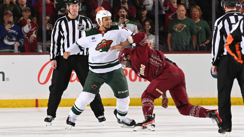 Ryan Reaves (left) of the Minnesota Wild dropped the gloves with Bokondji Imama of the Arizona Coyotes in a dud of a fight. (Photo by Norm Hall/NHLI via Getty Images)