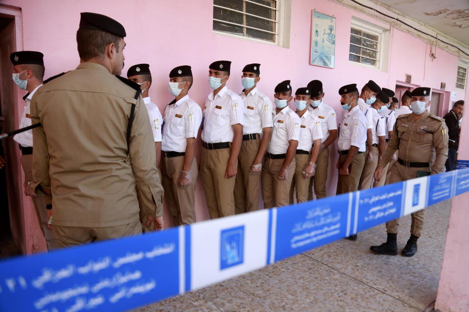 Security forces gather to vote during a special voting ahead of Sunday's parliamentary election in Baghdad, Iraq, Friday, Oct. 8, 2021. (AP Photo/Hadi Mizban)