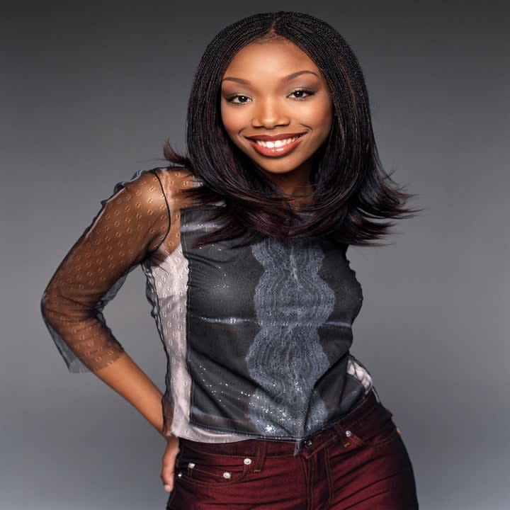 Photo of Brandy in a mesh top and red jeans