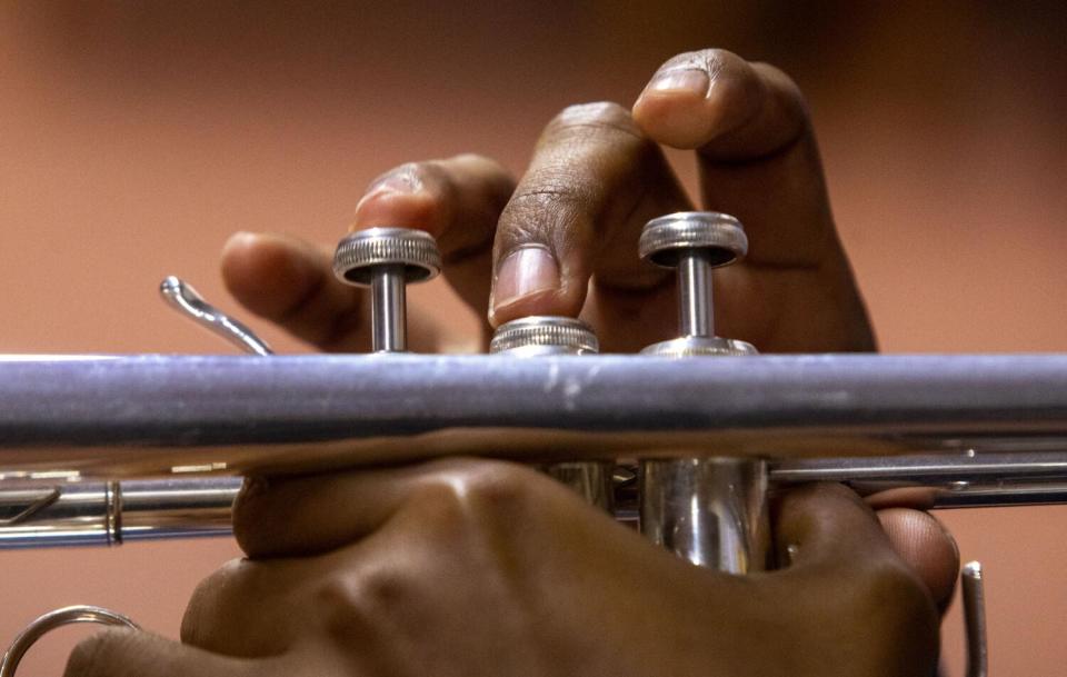 Jose Bravo practices playing his trumpet at Maqueos Music Academy, where students learn Oaxacan music, in Los Angeles