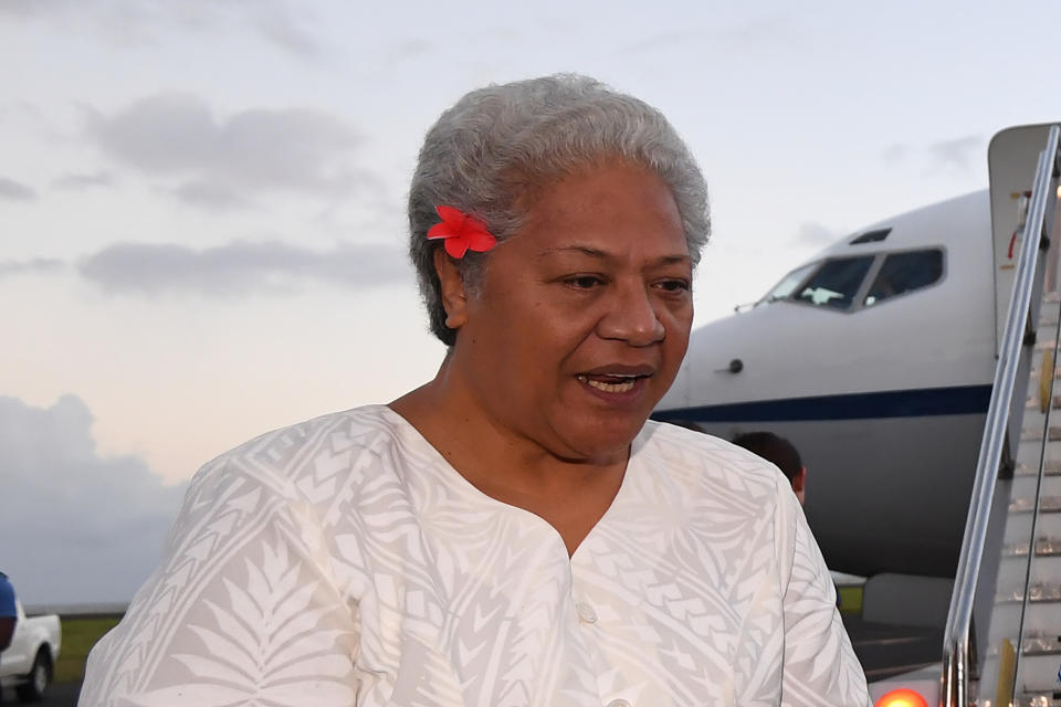 Then Deputy Prime Minister of Samoa Fiame Naomi Mata’afa speaks with Australian Prime Minister Malcolm Turnbull and the Australian High Commissioner to Samoa Sue Langford as they arrive at Faleolo Airport in Apia, Samoa on Sept. 8, 2017. More than three months after winning an election which sparked a constitutional crisis, Samoa's first female prime minister was finally able to take office on Tuesday, July 27, 2021. (Lukas Coch/AAP Image via AP)