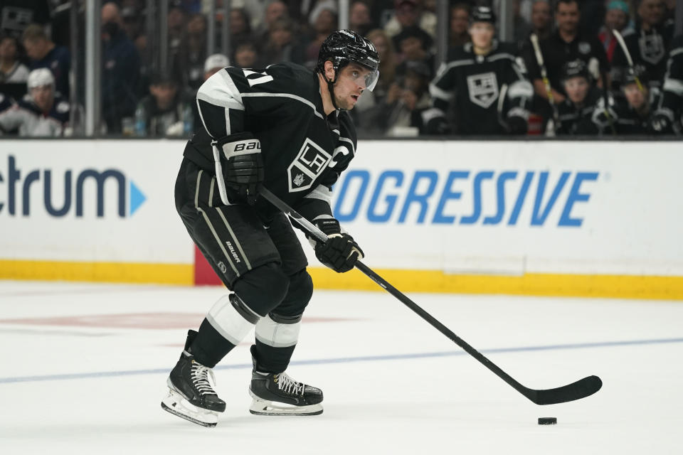 Los Angeles Kings center Anze Kopitar (11) controls the puck during the second period of an NHL hockey game against the Columbus Blue Jackets Saturday, April 16, 2022, in Los Angeles. (AP Photo/Ashley Landis)