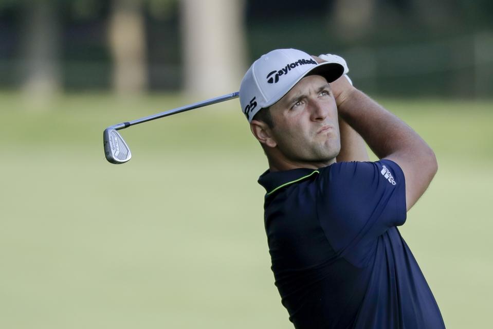 Jon Rahm, of Spain, hits on the 13th hole during opening round of the Workday Charity Open golf tournament, Thursday, July 9, 2020, in Dublin, Ohio. (AP Photo/Darron Cummings)