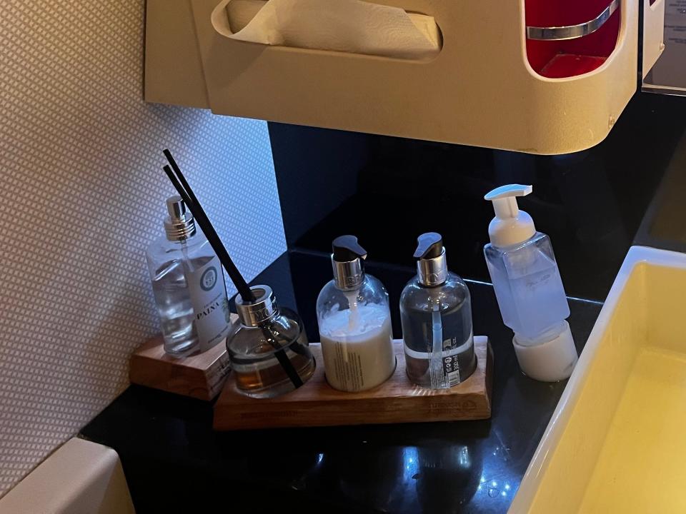 Moton Brown beauty amenities in Turkish Airlines bathroom with lotion and soap