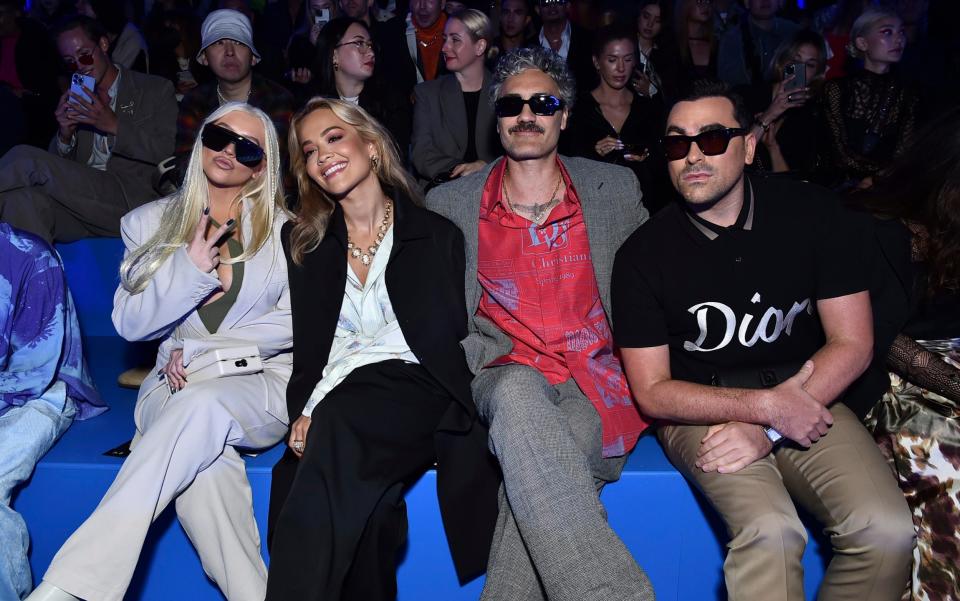 Christina Aguilera, Rita Ora, Taika Waititi and Dan Levy on the front row at the show - GETTY