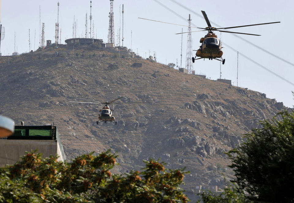 <p>Afghan Air forces helicopters fly over the site of a suicide attack followed by a clash between Afghan forces and insurgents during an attack on Iraq embassy in Kabul, Afghanistan, July 31, 2017. (Omar Sobhani/Reuters) </p>