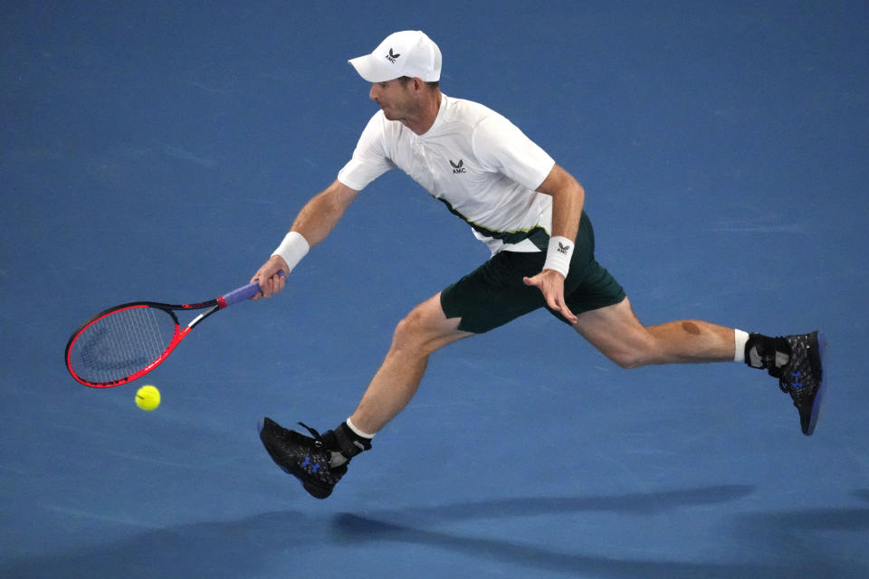 Andy Murray of Britain plays a forehand return to Matteo Berrettini of Italy during their first round match at the Australian Open tennis championship in Melbourne, Australia, Tuesday, Jan. 17, 2023. (AP Photo/Aaron Favila)