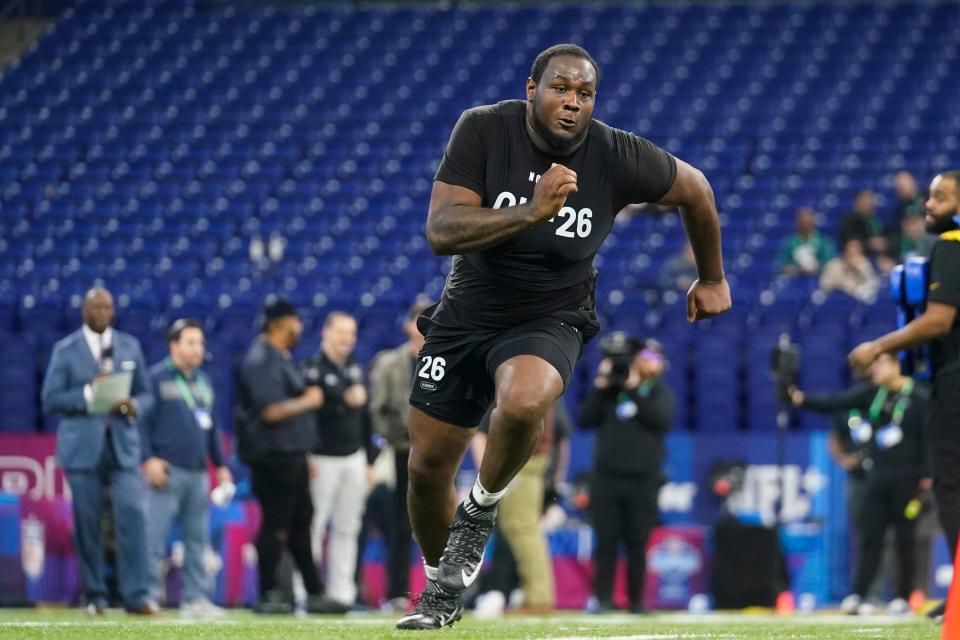 Ohio State offensive lineman Dawand Jones runs a drill at the NFL combine in Indianapolis, Sunday, March 5, 2023.