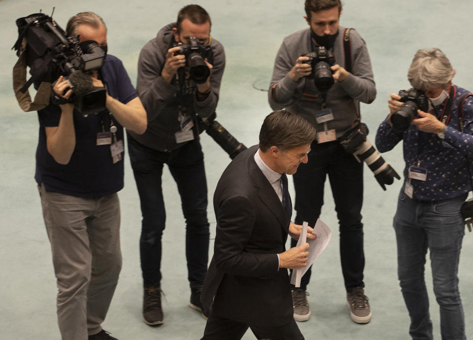 Journalists take images of caretaker Dutch Prime Minister Mark Rutte as he arrives for debate in parliament in The Hague, Netherlands, Thursday, April 1, 2021. Rutte was fighting for his political life Thursday in a bitter parliamentary debate about the country's derailed process of forming a new ruling coalition following elections last month. (AP Photo/Peter Dejong)