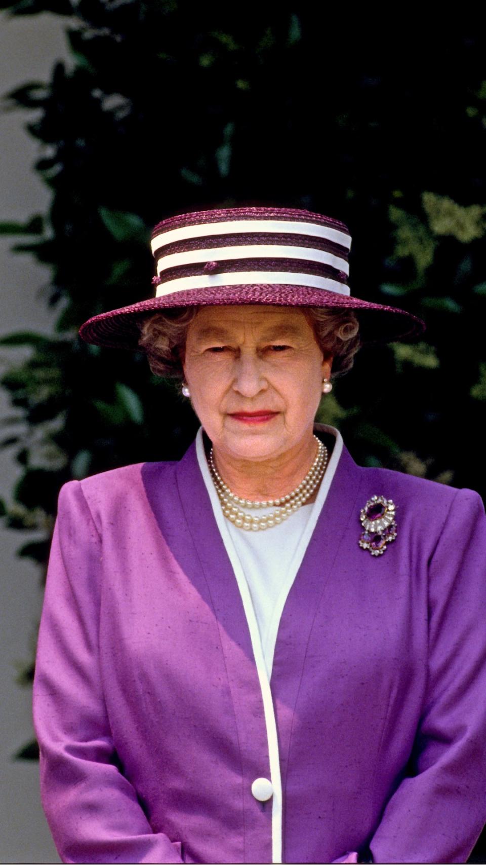 A purple and white striped Boater style hat, 1991