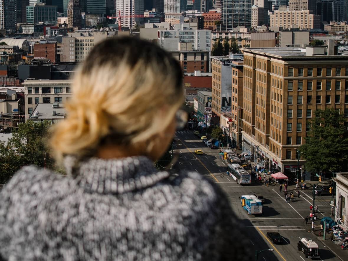 A woman who was allegedly sexually assaulted by Van Chung Pham is pictured as she looks out over the Downtown Eastside. The woman learned this week that Pham was released from custody despite concerns about the threat he posed to the public. (Ben Nelms/CBC - image credit)