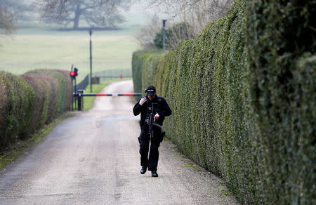 An armed police officer patrols the entrance to Chequers, the official country residence of the Prime Minister, near Aylesbury, Britain, February 22, 2018. REUTERS/Darren Staples