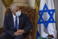 Israeli Foreign Minister Yair Lapid, meets with Egyptian Foreign Minister Sameh Shoukry at Tahrir Palace in Cairo, Egypt, Thursday, Dec. 9, 2021. (AP Photo/Nariman El-Mofty)