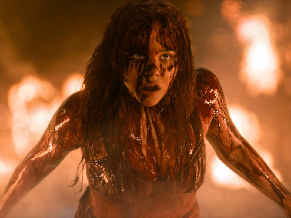 Chloe Grace Moretz as Carrie covered in blood.