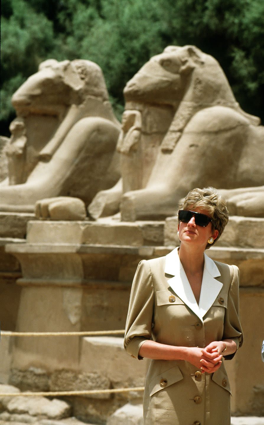 <p>The Princess of Wales wore a tan and white button down dress by Catherine Walker while visiting the Karnak Temple in Luxor, Egypt.</p>