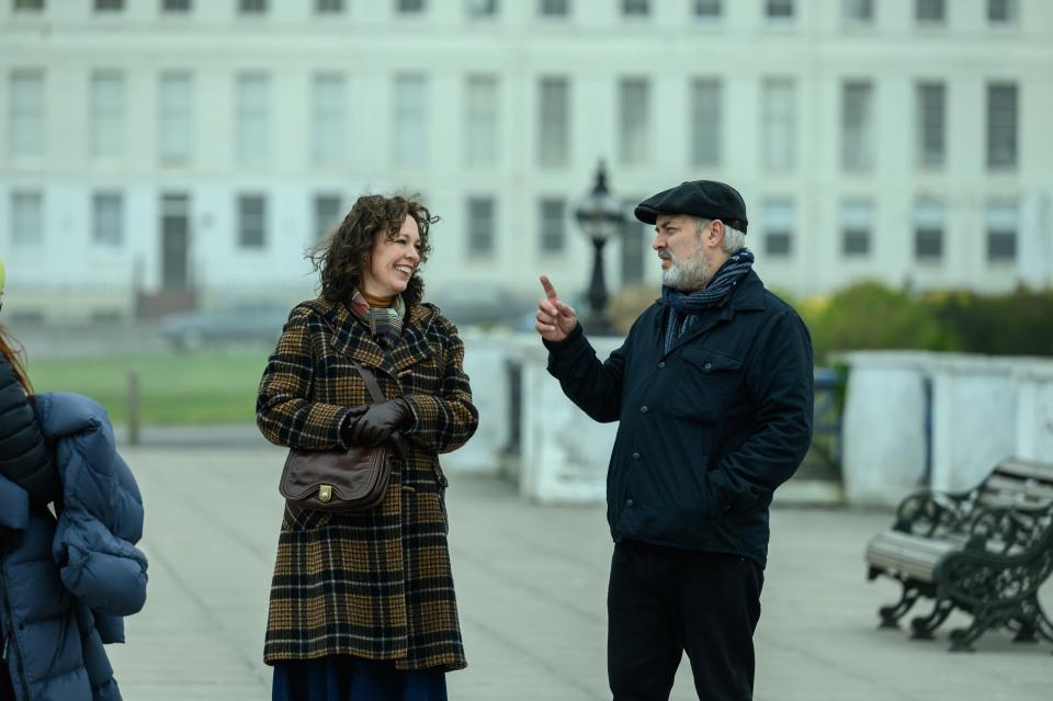 Olivia Colman, left, and filmmaker Sam Mendes on the set of "Empire of Light."