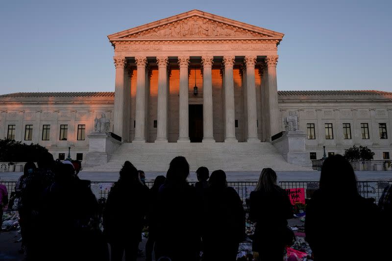 FILE PHOTO: People gather to mourn the death of Associate Justice Ruth Bader Ginsburg at the Supreme Court in Washington