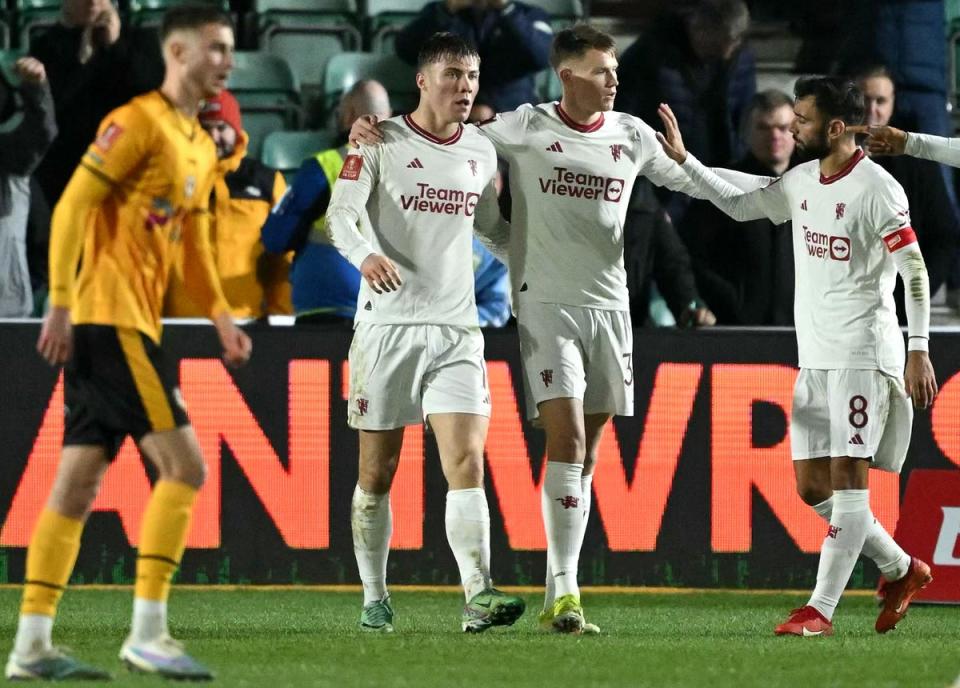 Manchester United celebrate scoring their fourth goal against Newport County (AFP via Getty Images)