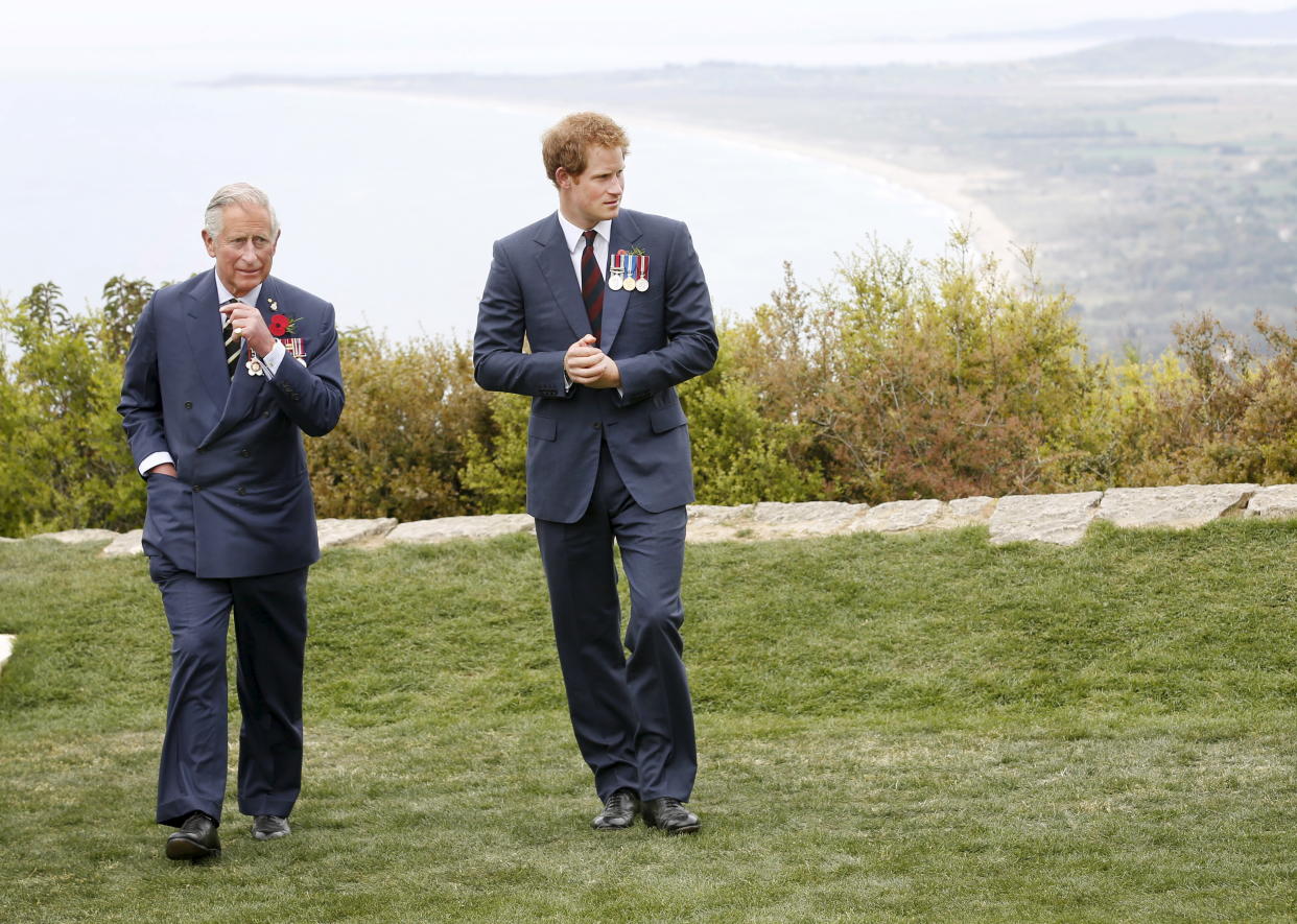 Britain's Prince Harry (R) and Prince Charles, Prince of Wales, look on during a visit to The Nek Cemetery, in Gallipoli, Turkey, April 25, 2015. Leaders and dignitaries from Australia, New Zealand and Turkey led thousands at dawn ceremonies on Turkey's Gallipoli peninsula on Saturday to mark the 100th anniversary of a World War One battle that helped shape their nations.  REUTERS/David Caird/Pool