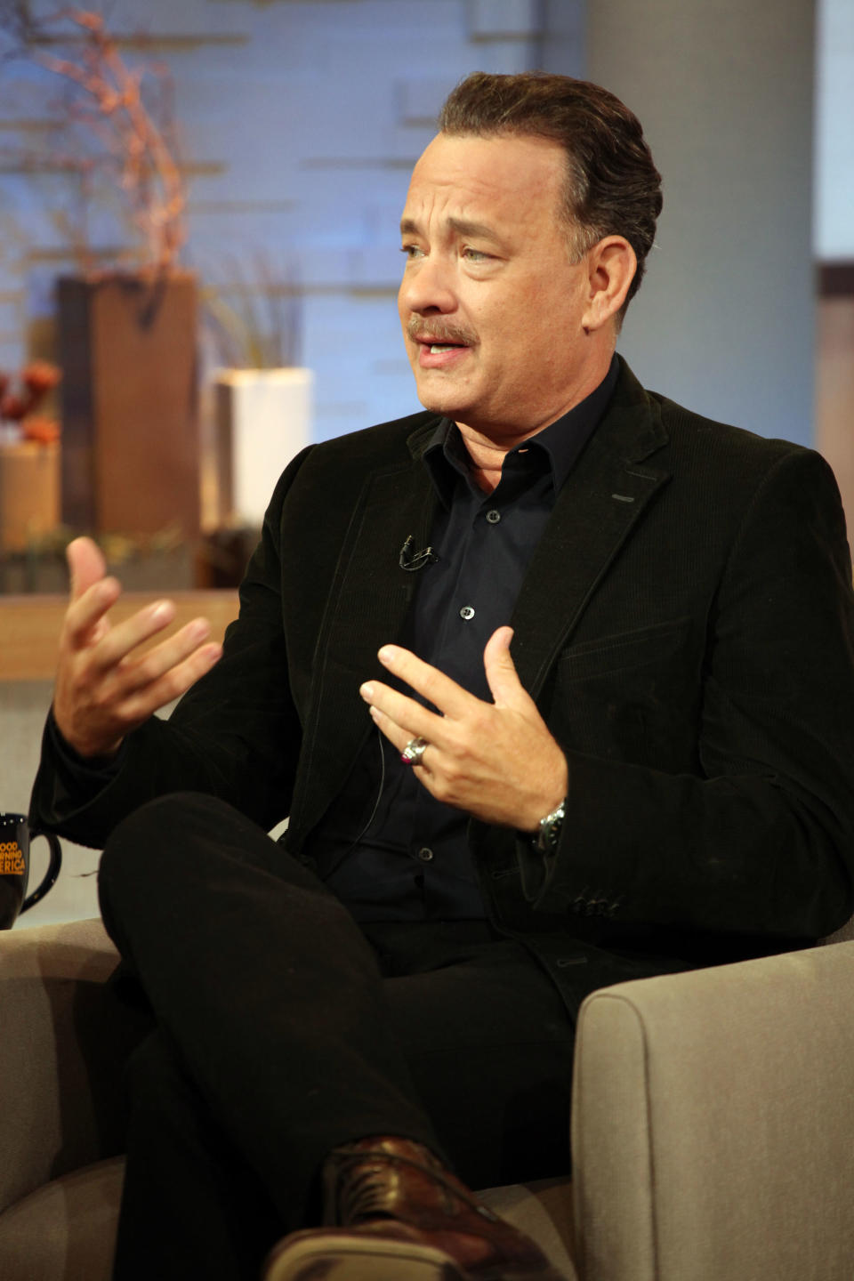 This image released by ABC shows actor Tom Hanks during an interview segment on "Good Morning America," Friday, Oct. 19, 2012 in New York. ABC and Tom Hanks are apologizing after the actor let slip a swear word during a live appearance on “Good Morning America.” Hanks telegraphed his “f-bomb” during an interview Friday. Anchor Elizabeth Vargas had asked him to speak in his character's British accent in the movie “Cloud Atlas.” Hanks said that it was “mostly swear words,” but Vargas told him to go ahead anyway. He began speaking in a mumble but the obscenity was clearly audible. ABC removed it for subsequent feeds of the show in the Midwest and West. (AP Photo/ABC, Fred Lee)