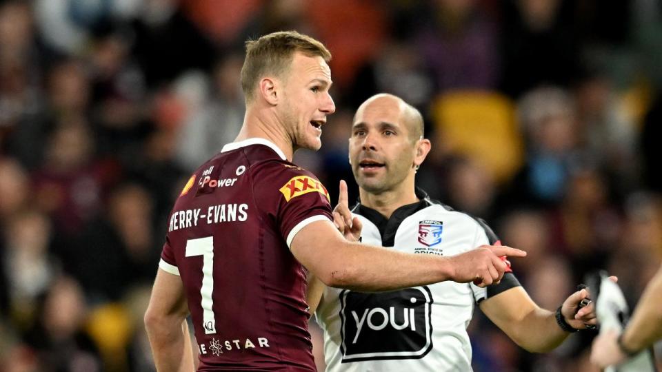 Daly Cherry-Evans talks to a ref for Queensland. 