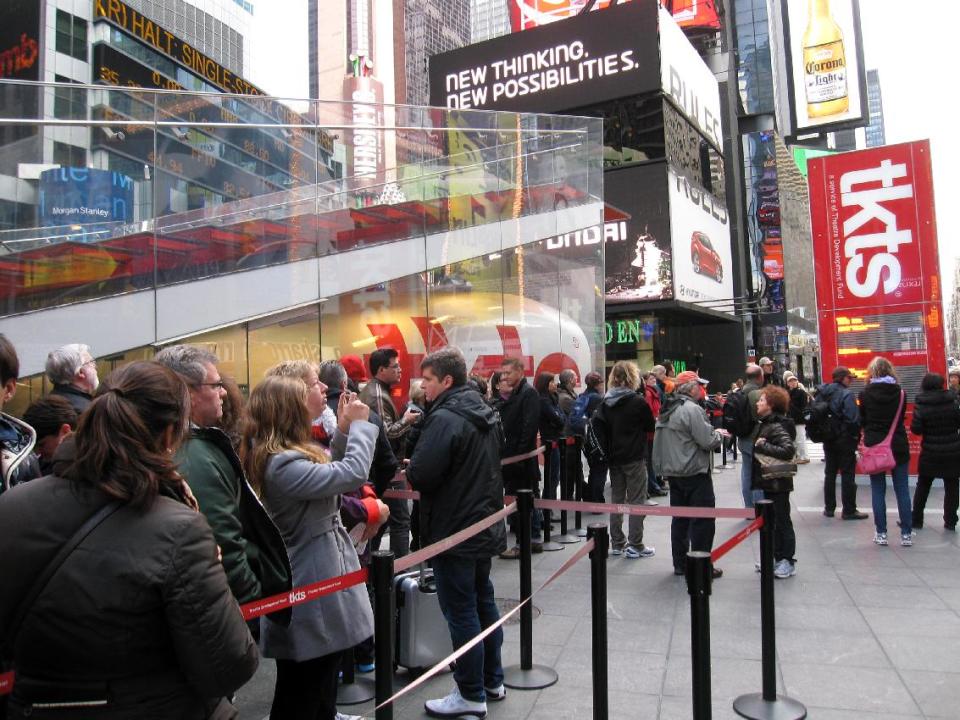 A line of ticket-buyers wait at the TKTS booth, which sells discount tickets to Broadway shows, in New York's Times Square on Wednesday, Oct. 31, 2012. Most Broadway theaters were reopening Wednesday for regular matinee and evening performances following several days of closures related to superstorm Sandy. (AP Photo/Beth J. Harpaz)