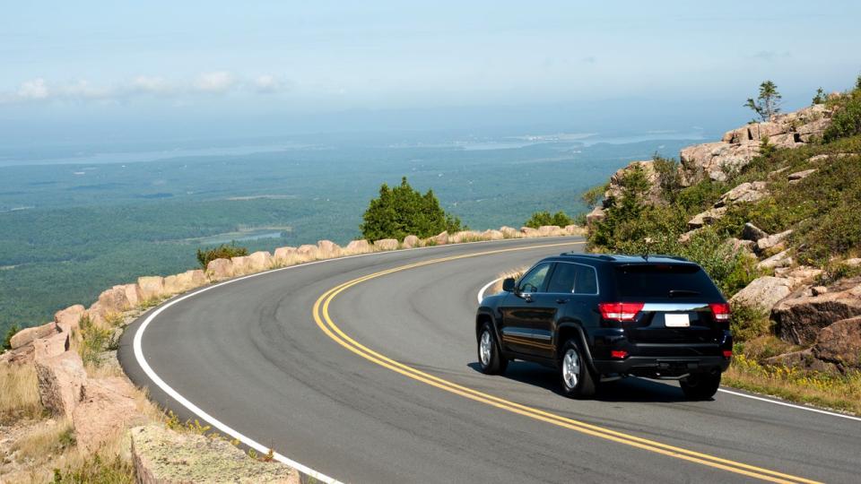 car driving along a road in Acadia National Park