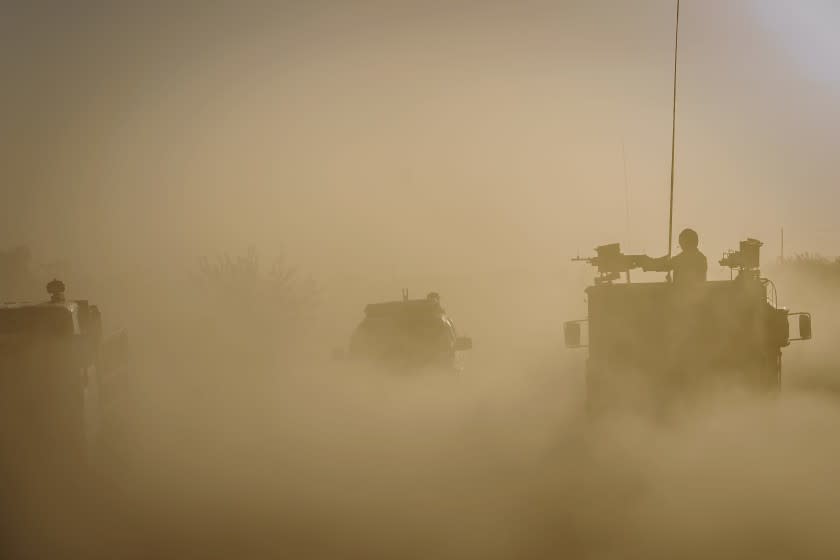 KANDAHAR, AFGHANISTAN -- OCTOBER 25, 2020: Afghan National Police patrol the roads heading towards the Panjwai district outside of Kandahar, Afghanistan, on Sunday Oct. 25, 2020. (Marcus Yam / Los Angeles Times)