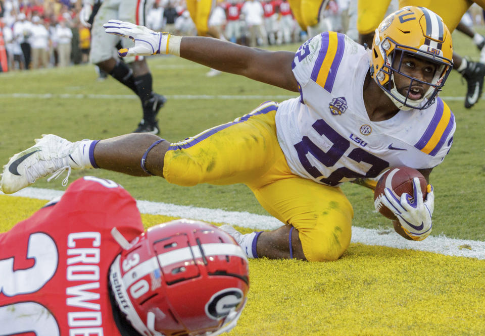 LSU running back Clyde Edwards-Helaire (22) is stopped just short of a touchdown by Georgia linebacker Tae Crowder (30) during the second half of an NCAA college football game in Baton Rouge, La., Saturday, Oct. 13, 2018. (AP Photo/Matthew Hinton)