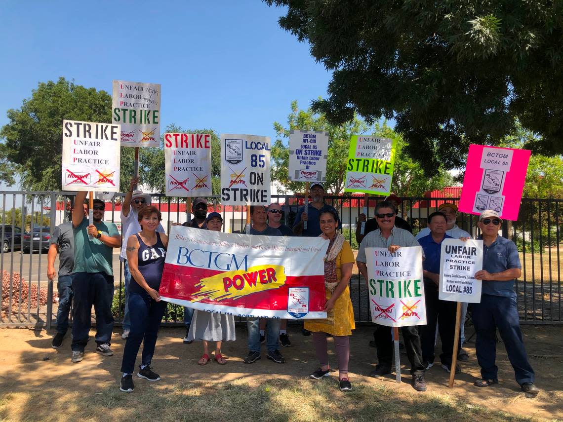 Around 20 Corn Nut workers gathered outside of a Fresno production facility as part of a strike on Aug. 18, 2022. They say Corn Nuts owner, Hormel Foods, is not bargaining in good faith.