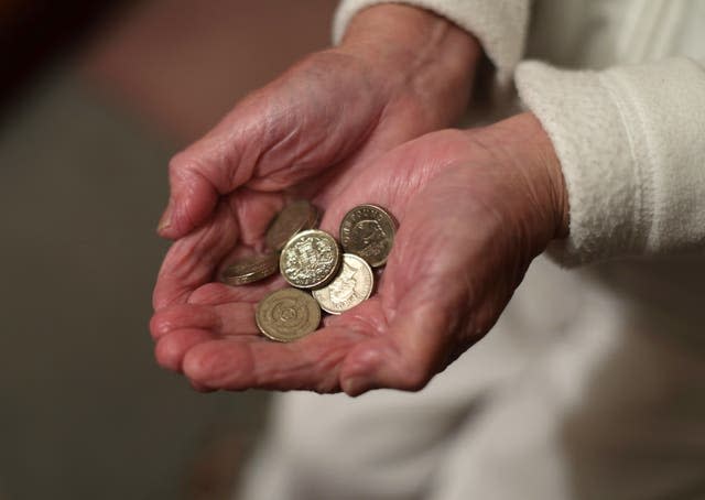 A woman holding coins