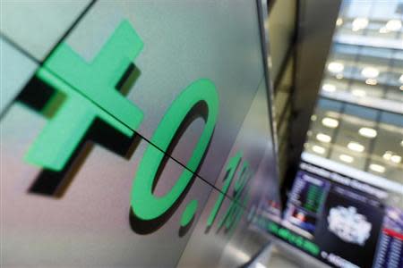 An electronic information board is seen at the London Stock Exchange in the City of London October 11, 2013. REUTERS/Stefan Wermuth