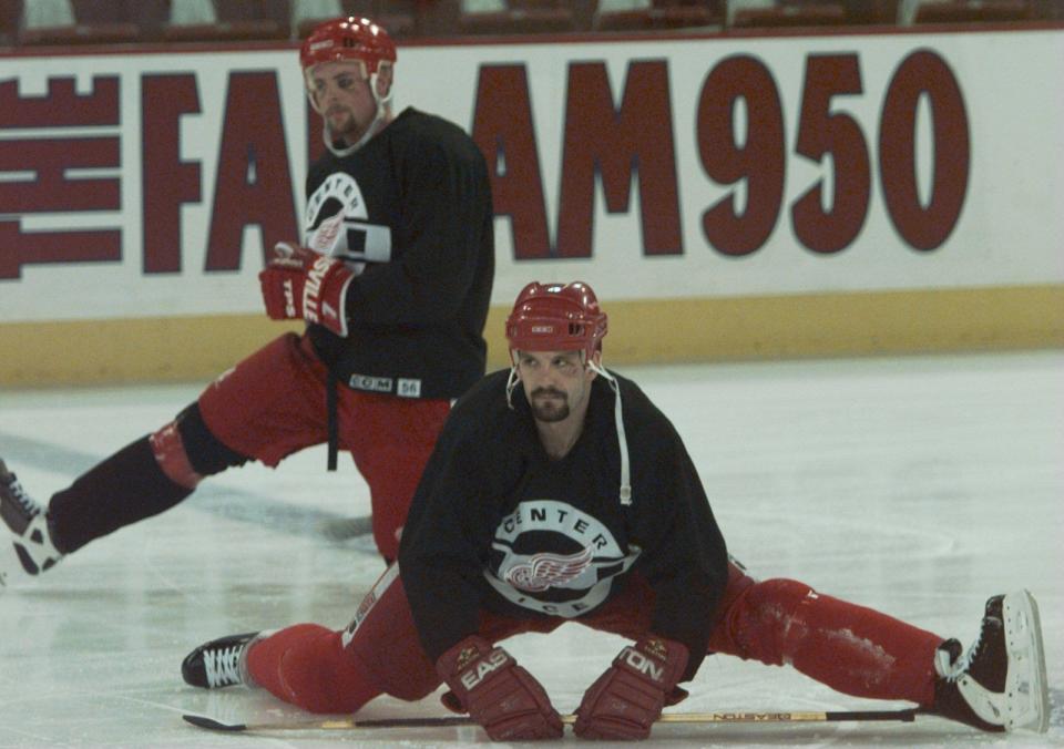 Detroit Red Wings' Brendan Shanahan, front, and Aaron Ward stretching before a practice skate at McNichols Sports Arena in Denver, May 23, 1997.