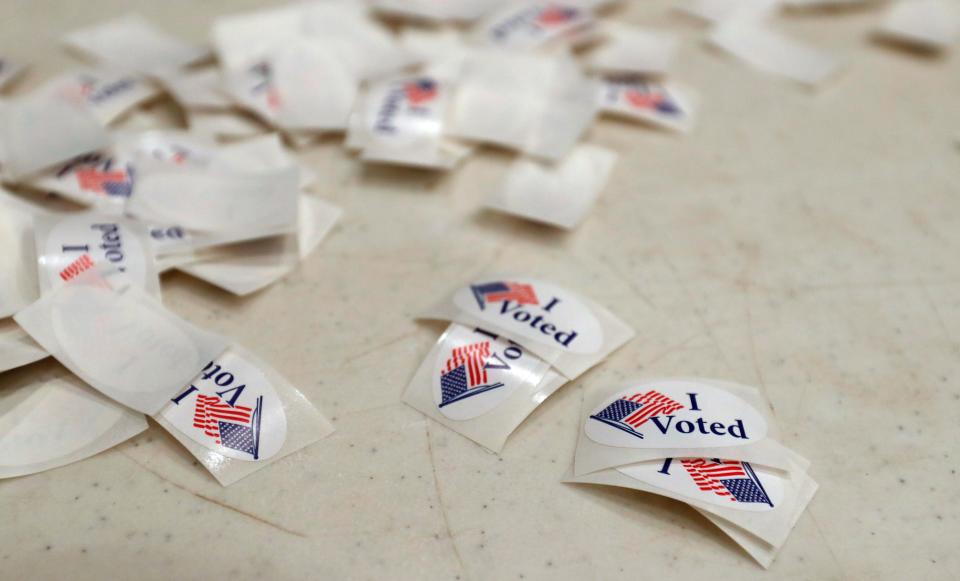 Stickers for voters are set in a pile for Election Day, Tuesday, May 7, 2024, at the Tippecanoe County Fairgrounds in Lafayette, Ind.