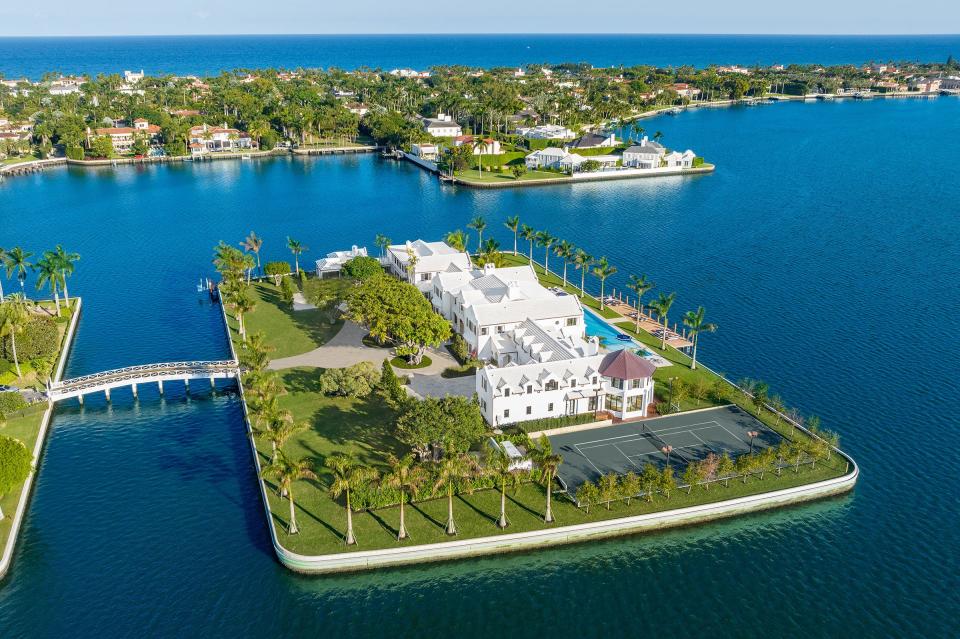 A bridge connects private Tarpon Island to the rest of Palm Beach, which can be seen at the far left and rear. The renovated-and-expanded mansion at 10 Tarpon Isle is listed at $187.5 million.