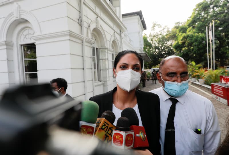 Reigning Mrs World Caroline Jurie leaves the police station in Colombo