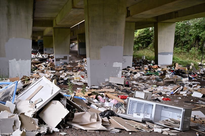 Mounds of rubbish dumped underneath the M8 motorway on August 19, 2021 in Glasgow