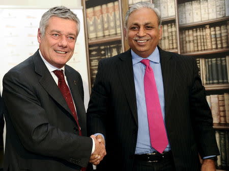 Italian engineer and designer Paolo Pininfarina (L) shakes hands with Chief Executive Officer and Managing Director of Tech Mahindra CP Gurnani after signing an agreement in downtown Turin northern Italy, December 14, 2015. REUTERS/Giorgio Perottino