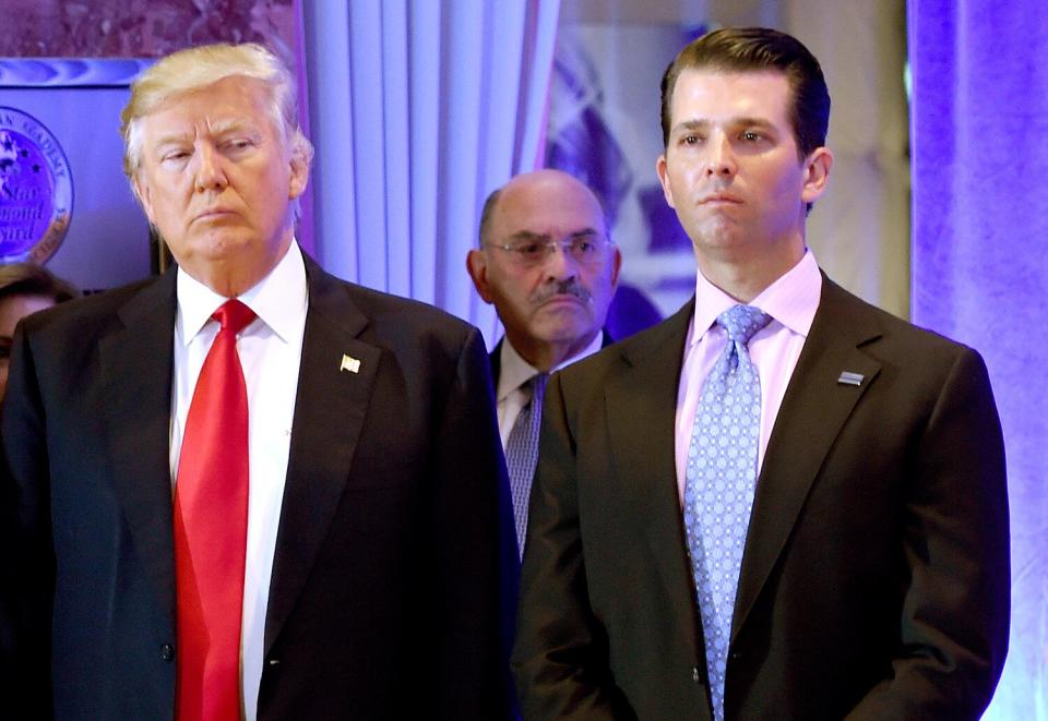 US President-elect Donald Trump along with his son Donald, Jr., arrive for a press conference at Trump Tower in New York, as Allen Weisselberg (C), chief financial officer of The Trump, looks on January 11, 2017. - As US President Donald Trump's former lawyer Michael Cohen delivered hours of riveting testimony to a US House committee on February 27, 2019, one name came up again and again: Allen Weisselberg. Weisselberg, 71, is the publicity-shy chief financial officer of the Trump Organization and one of the real estate tycoon's oldest and closest advisors.