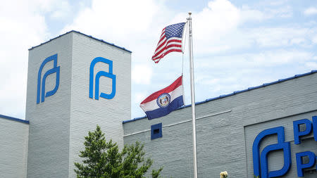 A Missouri State Flag waves outside the Reproductive Health Services of Planned Parenthood St. Louis Region, Missouri's sole abortion clinic, in St. Louis, Missouri, U.S. May 28, 2019. REUTERS/Lawrence Bryant
